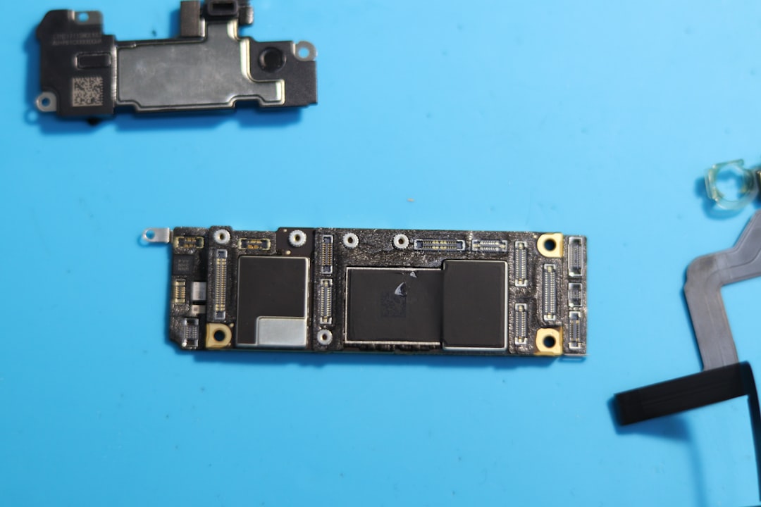 disassembled-phone-circuit-board-components-visible-lhox0i41rgo
